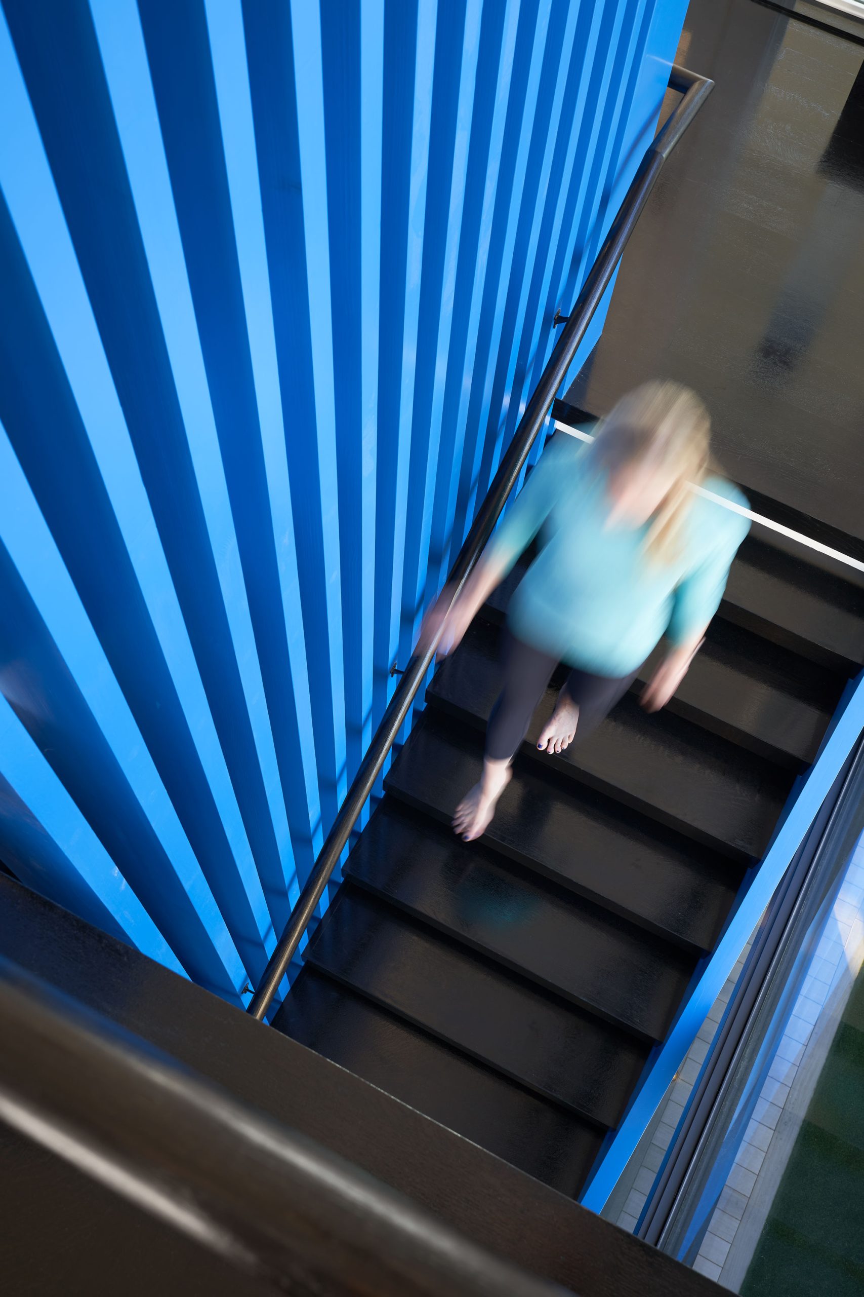 Exterior view of residential home stairwell at night