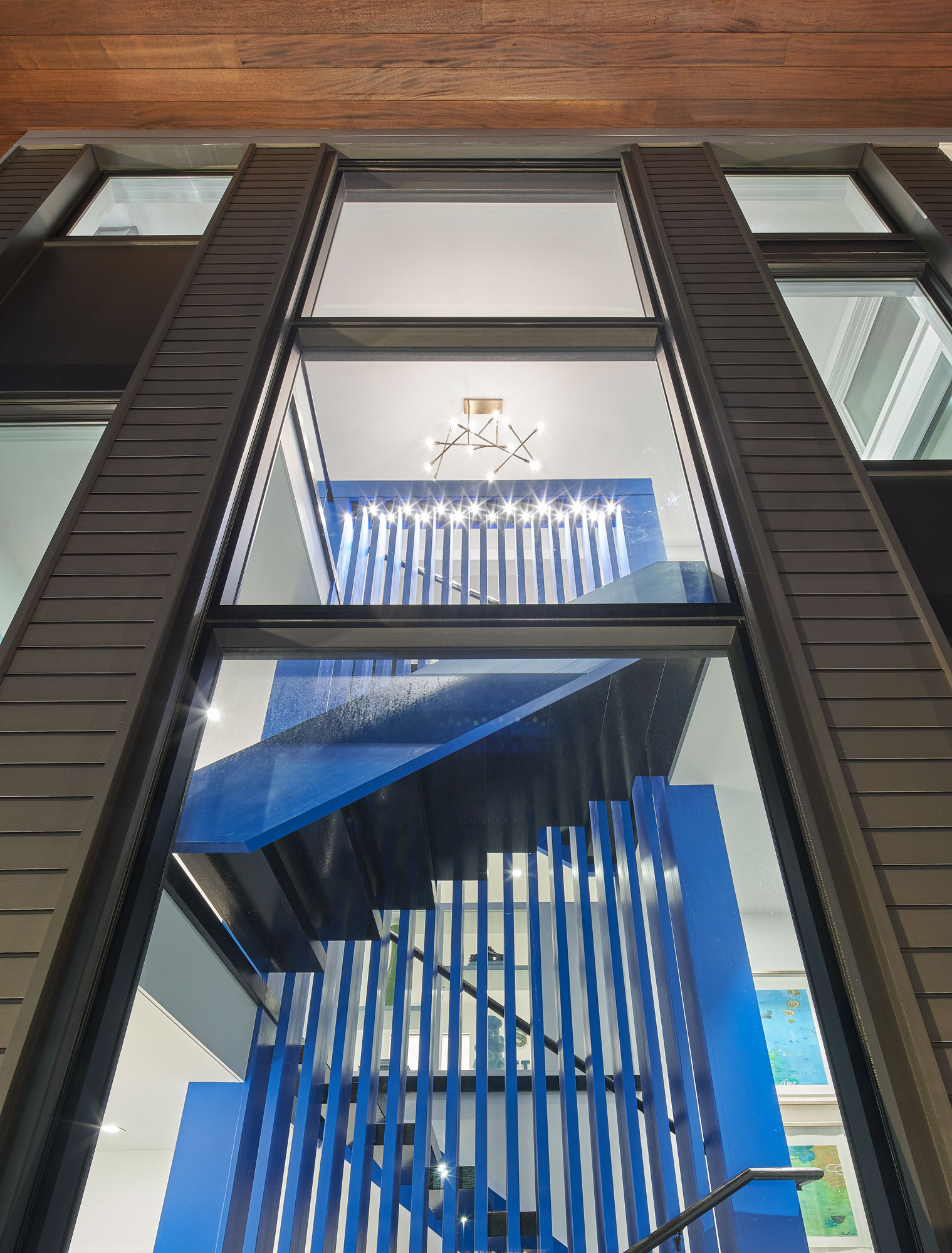 Exterior view of residential home stairwell at night