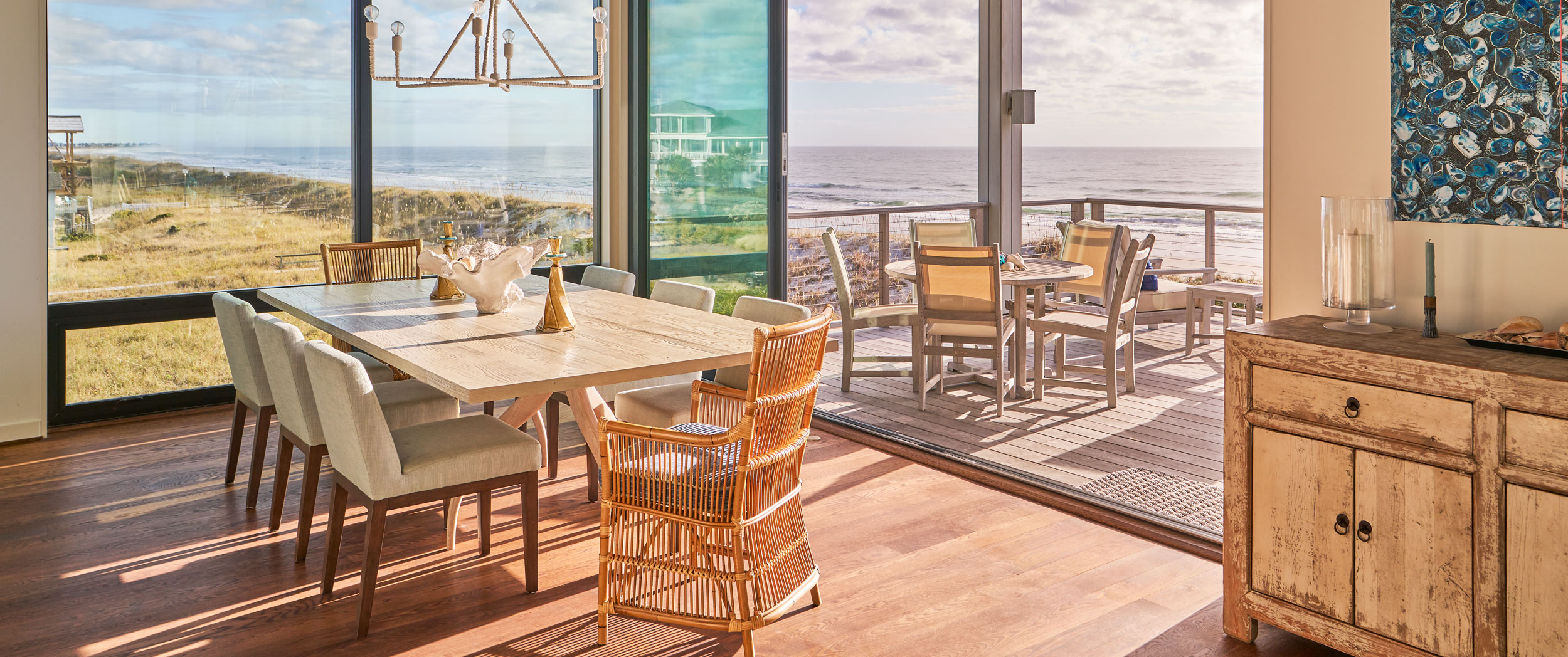 Dining area with a sitting area on porch behind it