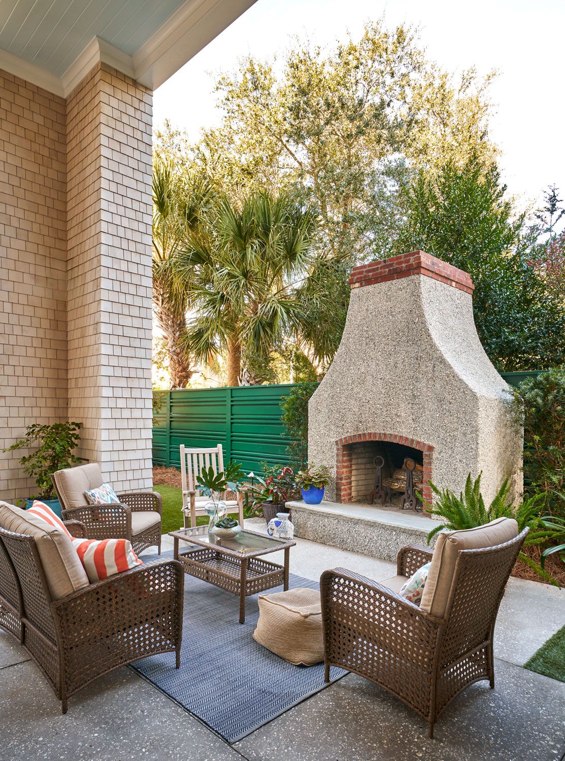 Exterior fireplace with sitting area in front of it